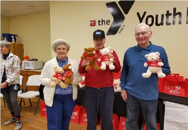 Seniors holding teddy bears Seniors holding teddy bears